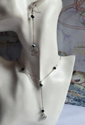 Necklace on a mannequin bust with a decorative background